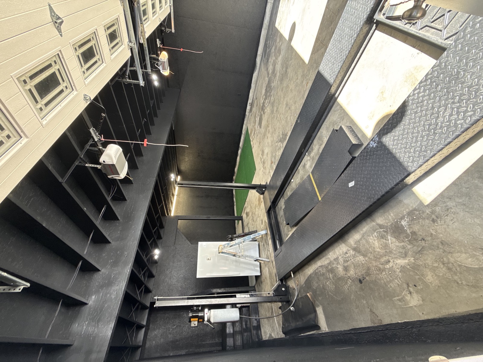 Black painted garage and workshop ceiling with finished walls