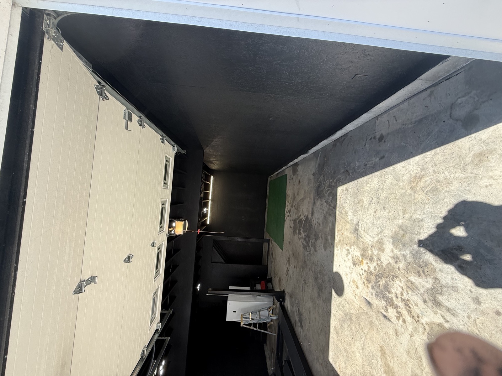 Painted garage interior with black walls and ceiling