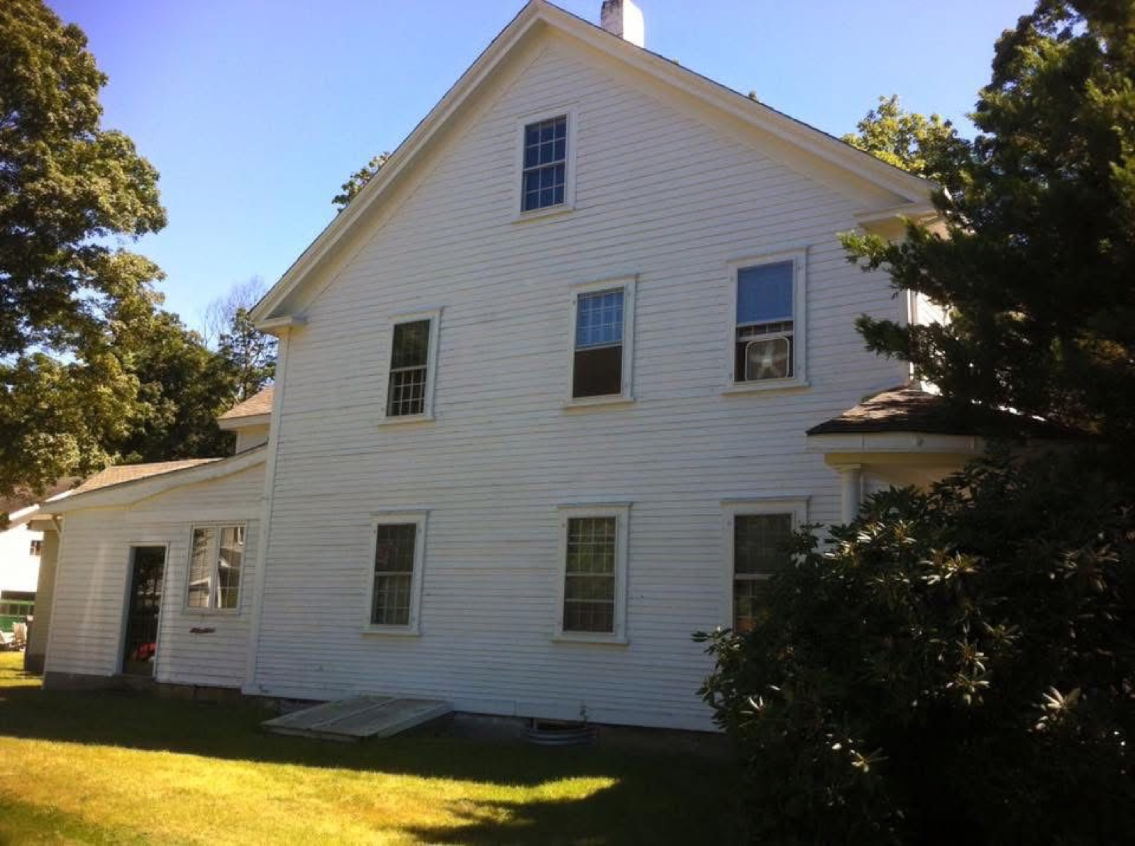 Finished white exterior house painting project